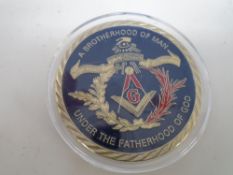 A Masonic Brotherhood of Man commemorative coin.