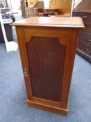 An Edwardian mahogany pot cupboard.