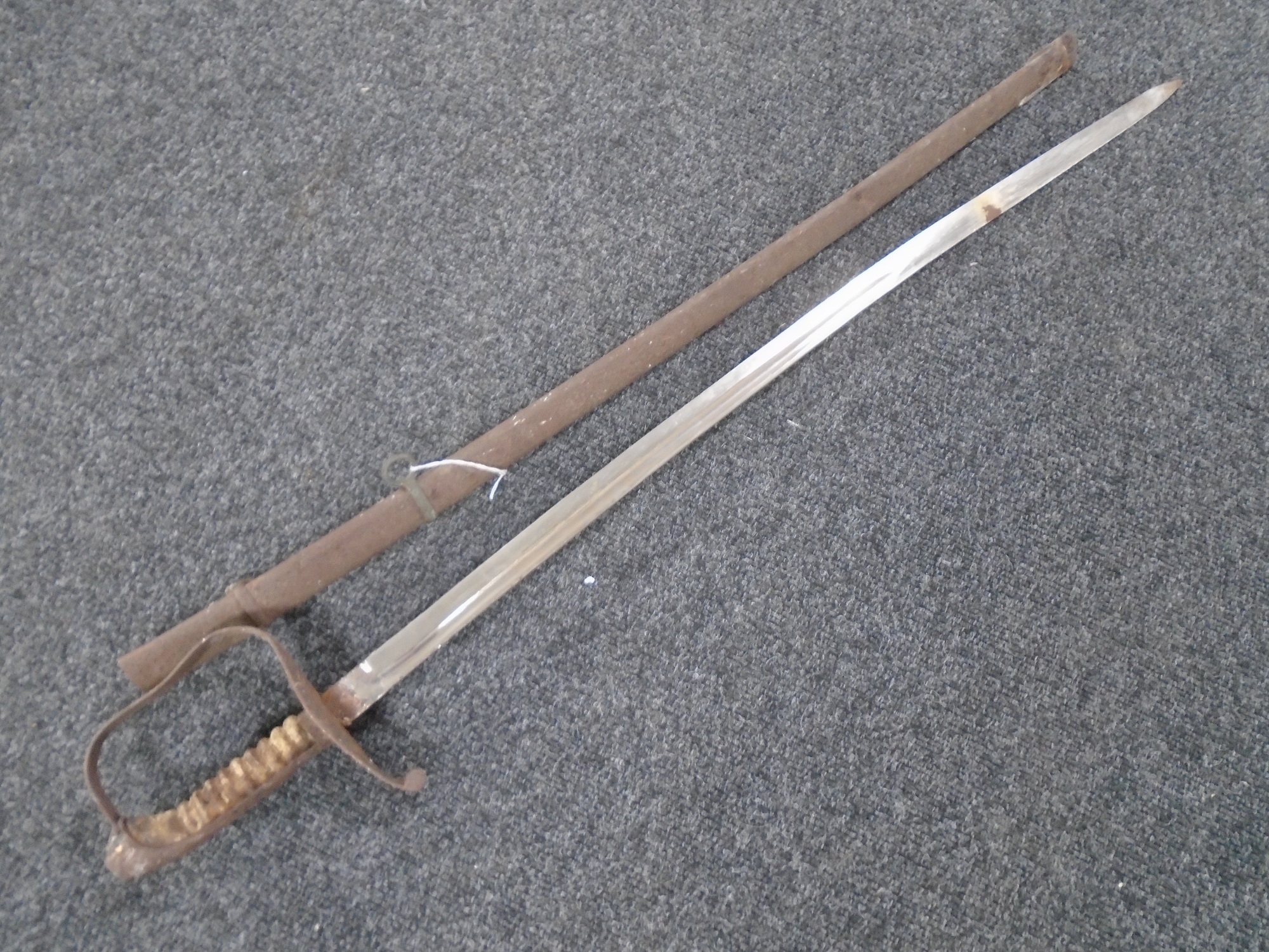 A 19th century naval sword in sheath.