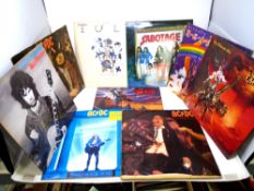 A box containing rock vinyl LPs including Jethro Tull, Black Sabbath, Deep Purple, Iron Maiden,