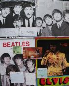 A collection of Beatles and Elvis Presley calendars, and vintage concert tickets from Frank Zappa,