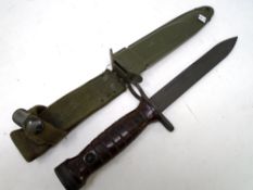 An American US M8A1 bayonet in sheath.