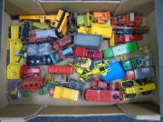 A crate containing 20th century die cast vehicles including Dinky Toys Conveyancer,