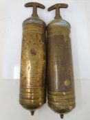 Two vintage Pyrene brass fire extinguishers.