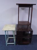 An Edwardian revolving book table together with two occasional tables