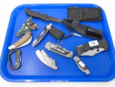 A tray of assorted pocket knives.