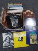 A box containing vinyl LPs including jazz, classical etc.