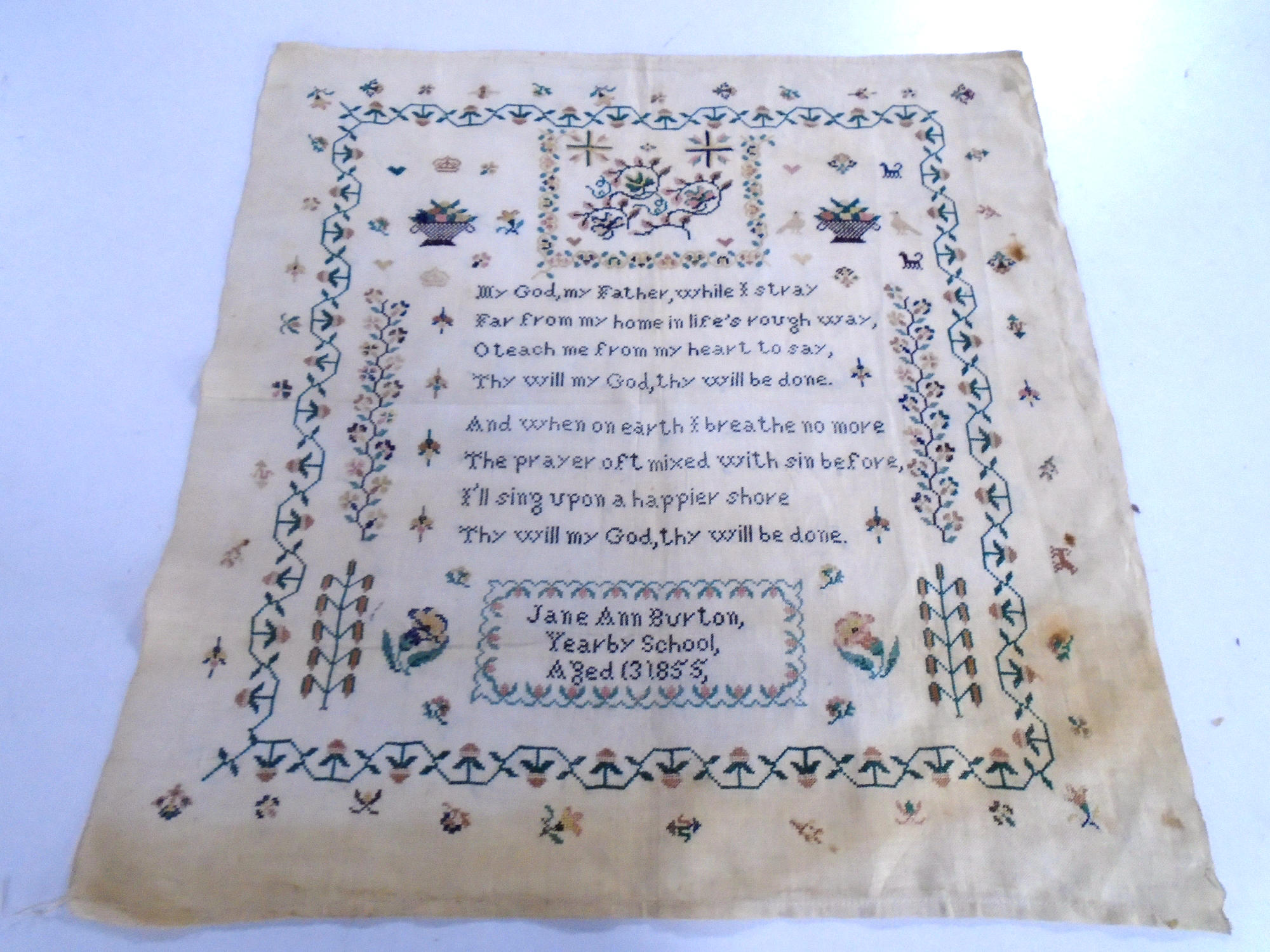 A Victorian sampler by Jane Anne Burton 1855, unframed.