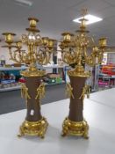 A pair of decorative French gilt metal five-way table candelabra,