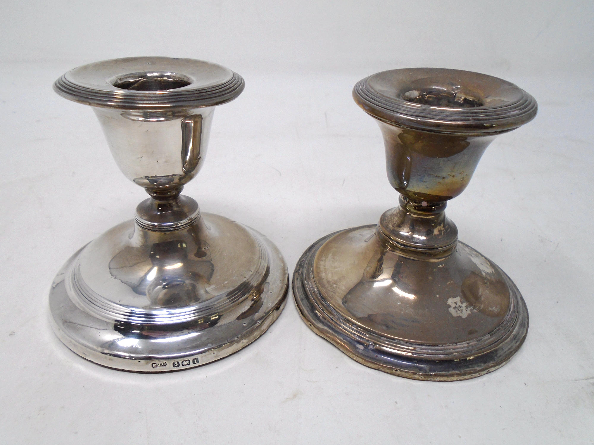 Two Birmingham silver squat candlesticks.