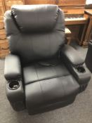 An electric reclining massage armchair with cup holders (hand set af)