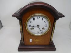 A late 19th century Junghans inlaid mahogany bracket clock with enamelled dial.