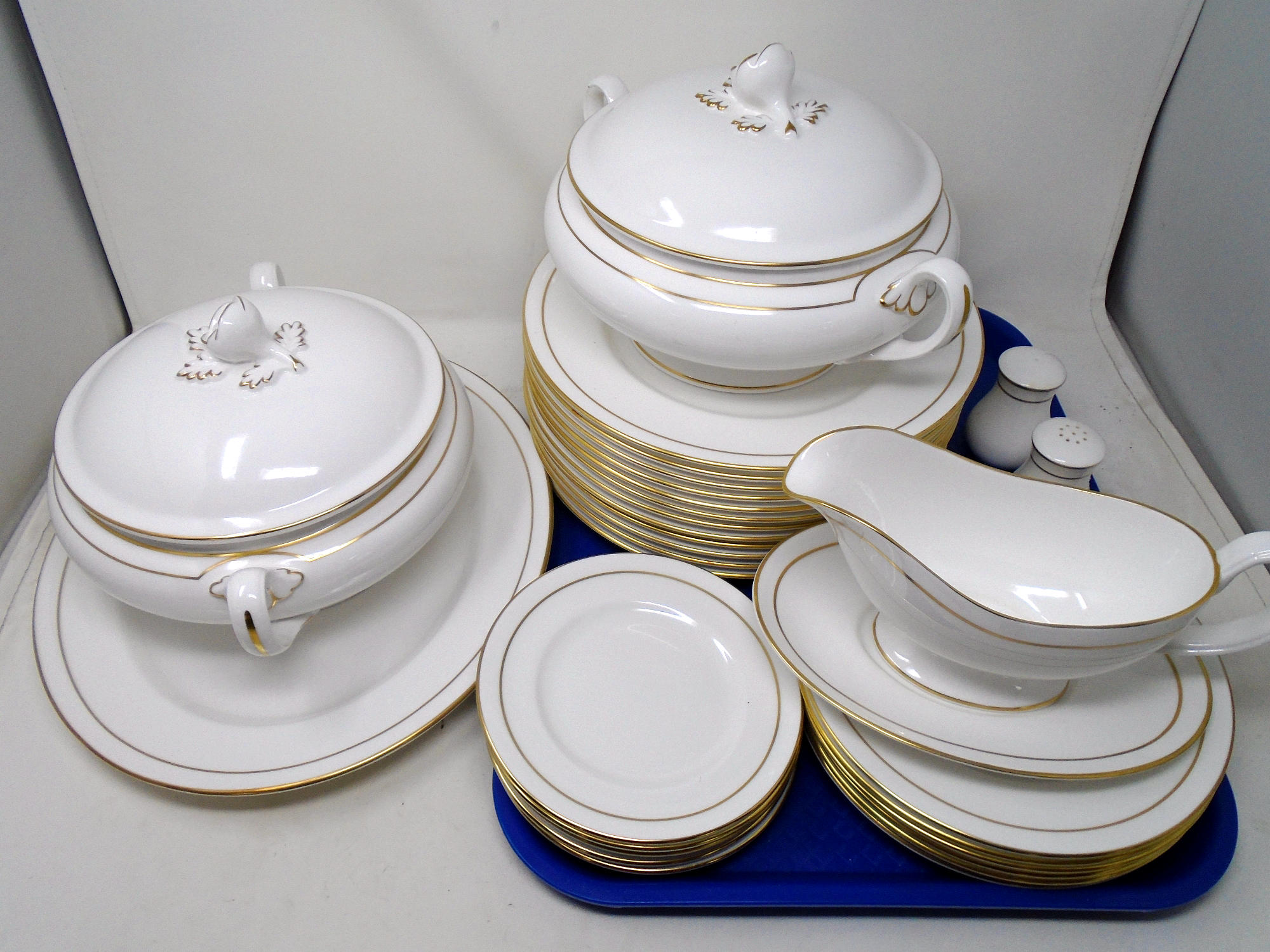 A set of 32 pieces of Royal Worcester Contessa white and gilt dinner ware.
