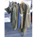Three 20th century British Army and Air force tunics together with a woolen great coat, army shirt,