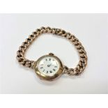 A lady's 9ct gold wristwatch on 9ct gold Albert chain bracelet CONDITION REPORT: