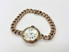 A lady's 9ct gold wristwatch on 9ct gold Albert chain bracelet CONDITION REPORT:
