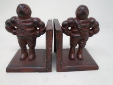 Two cast iron Michelin Man bookends.