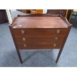 A Regency style three drawer cutlery chest on raised legs with gallery