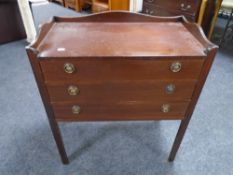 A Regency style three drawer cutlery chest on raised legs with gallery