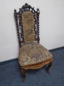 A 19th century carved hall chair on cabriole legs