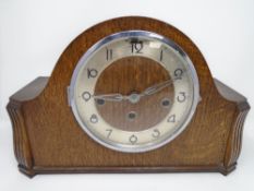 A 20th century oak cased Westminster chime mantel clock together with a P.I.
