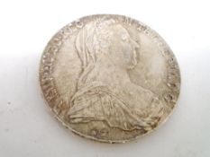 An Austrian silver Maria Theresa thaler.