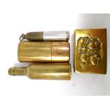 A vintage brass cased lighter in the form of a bottle together with a brass matchbox holder and two