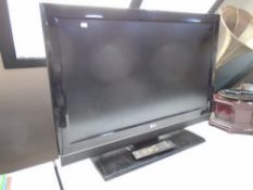 A LG 37" LCD TV with remote.