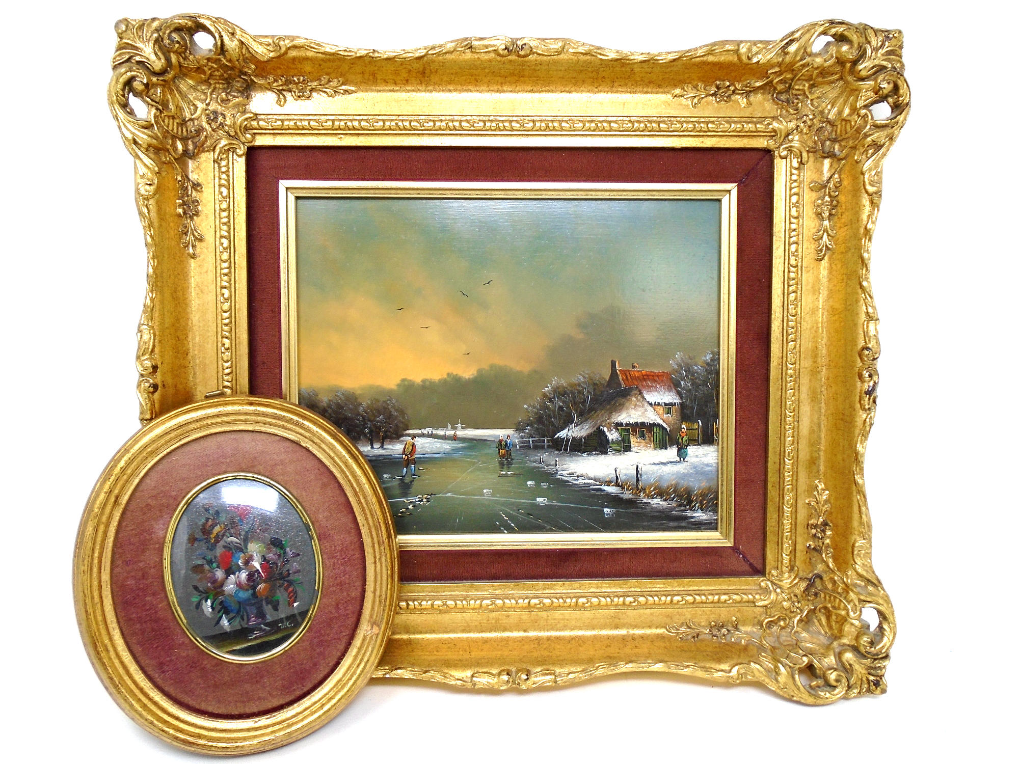 A Dutch oil on panel depicting figures on a frozen river in decorative gilt frame together with a