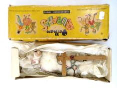 A boxed Pelham puppet of a poodle.