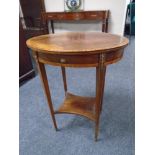 A 19th century inlaid mahogany oval occasional table with gilt metal mounts