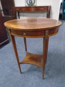 A 19th century inlaid mahogany oval occasional table with gilt metal mounts
