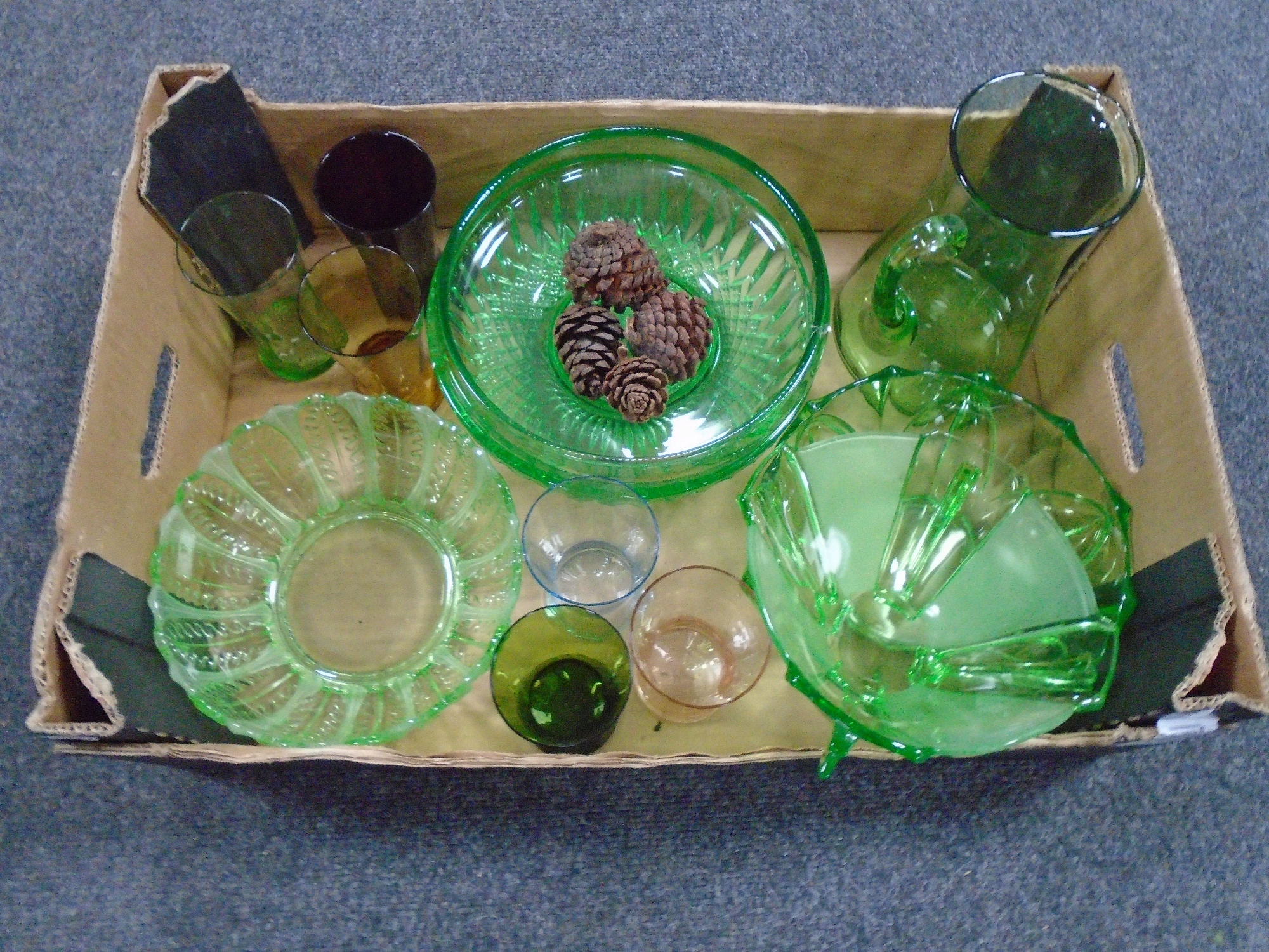 A box containing 20th century coloured glassware.