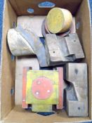A box containing five vintage wooden moulds.