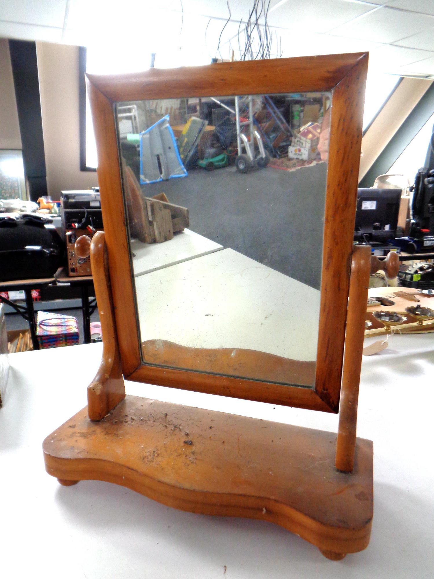 A Victorian pine dressing table mirror