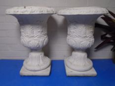 A pair of concrete classical planters (painted).