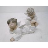 Two Lladro figures of cherubs.