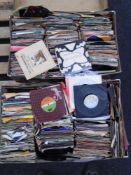 Two cases containing a quantity of vinyl 7" singles including Rod Stewart, Commodores, Tracy Ullman,