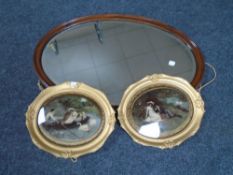 An oval mahogany bevelled mirror together with two 19th century gilt framed crystoleums