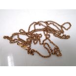 A gold plated muff chain