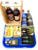 A tray containing assorted alcohol including Glenmorangie and Ardbeg scotch whiskies in tins,