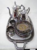 A silver plated twin handle serving tray together with a four piece tea service,