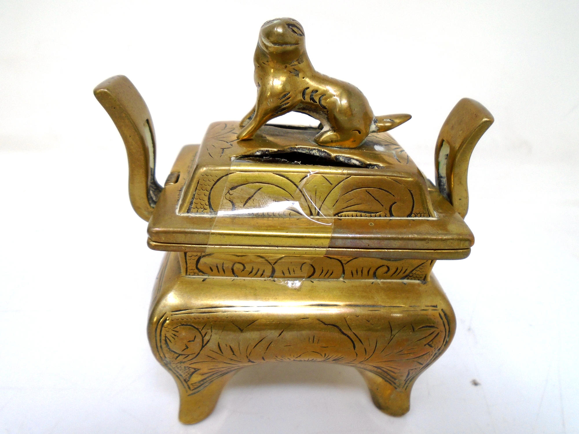 A Chinese brass lidded censer.