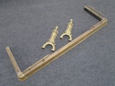 An antique brass fire curb together with two part brass fire dogs.