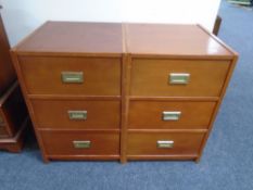 A pair of three drawer ship's style chests with brass drop handles.