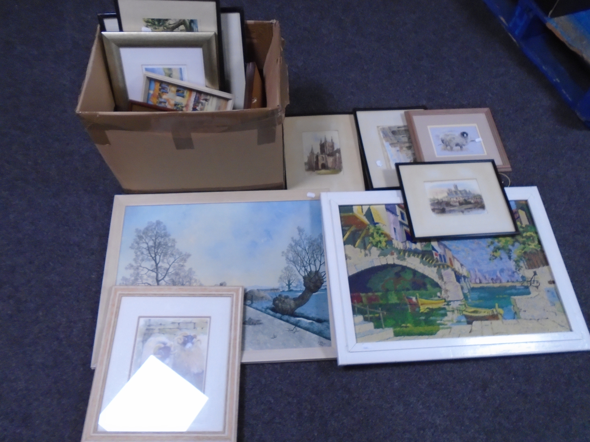 A box containing assorted pictures prints including signed prints, oil-on-board Venice canal scene,