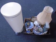 A box containing collectors plates, coasters, contemporary table lamps,
