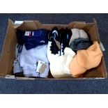 A box containing a pair of Under Armour Hover trainers, Tommy Hilfiger jogging bottoms and t-shirt,