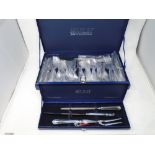 A canteen of Housley International stainless steel cutlery together with a similar boxed carving