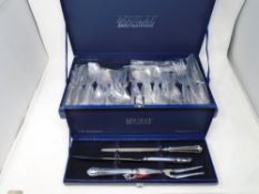 A canteen of Housley International stainless steel cutlery together with a similar boxed carving